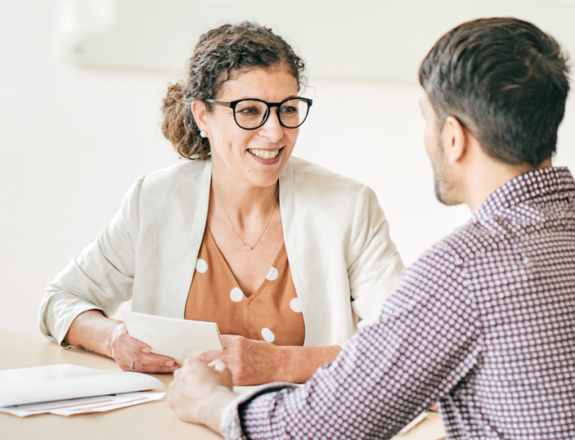 office employee discussing professional development with a colleague