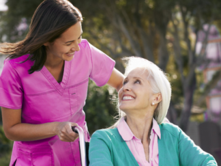 care assistant providing companionship care outdoors